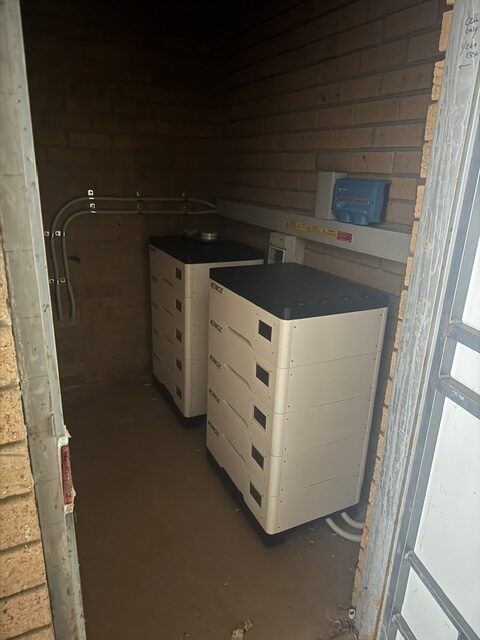 Two RENOZ battery stacks in a brick enclosure